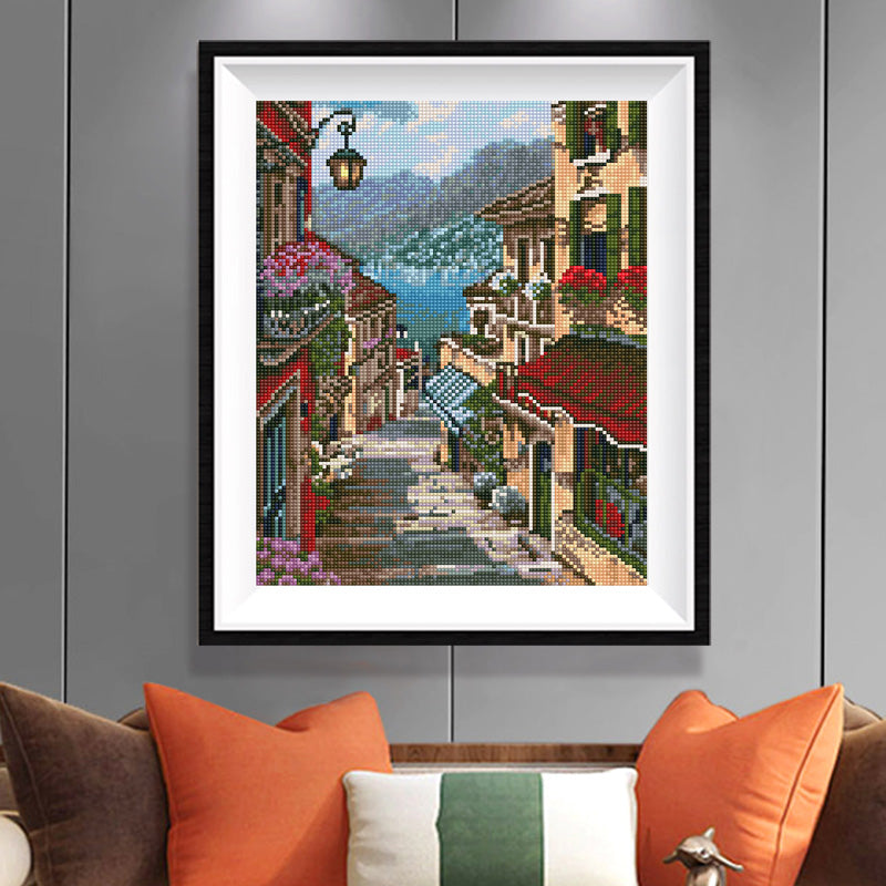 Mediterranean Village Diamond Painting Kit – Romantic Cobblestone Street with Mountain Lake View JX131